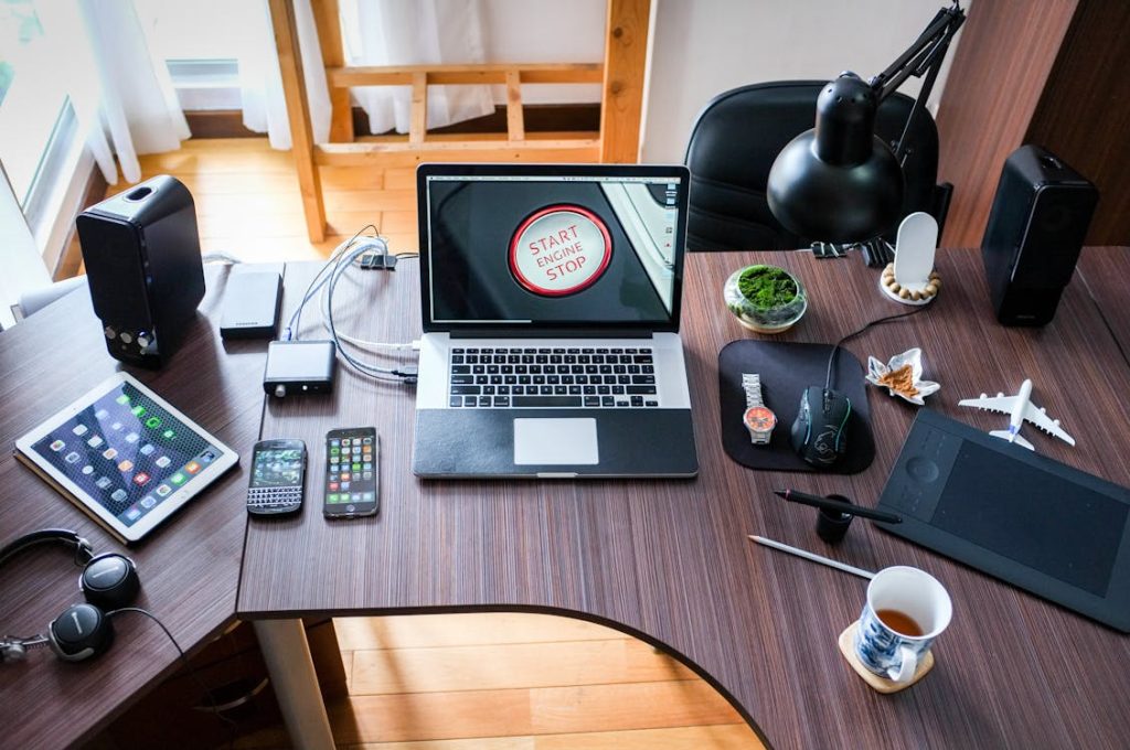 Free Black and White Laptop Computer on Brown Wooden Desk Stock Photo